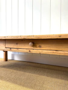 An Antique 6.5 ft English Country Pine Coffee Table