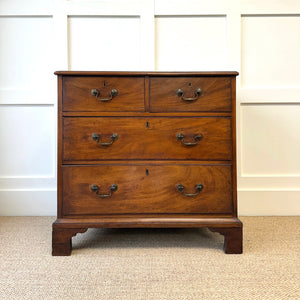 A English Georgian Chest of Drawers with Swan Neck Hardware