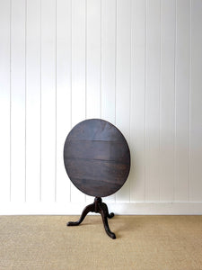 A George III Oak Circular Tilt-Top Tripod Tea Table