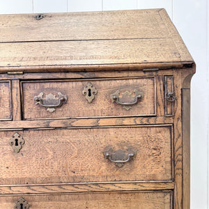 An Antique English Georgian Cumbrian Washed Oak Slant Front Desk