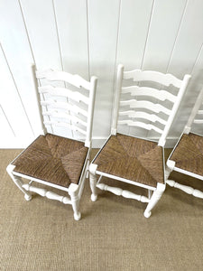 A Set of 4 Ladderback Rush Seat Chairs Painted White