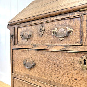 An Antique English Georgian Cumbrian Washed Oak Slant Front Desk