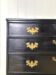 An Ebonized Antique English Chest of Drawers/Dresser