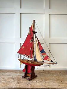 An English Antique Red Pond Yacht with Stand