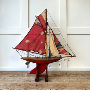 An English Antique Red Pond Yacht with Stand