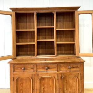 A 19th Century English Pine Bookcase Cabinet or Hutch with Arched Doors
