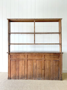 An Early 19th Century Monumental Pine Welsh Dresser or Cupboard