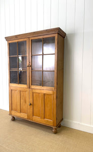 An English 19th Century Pine Bookcase with Glazed Doors
