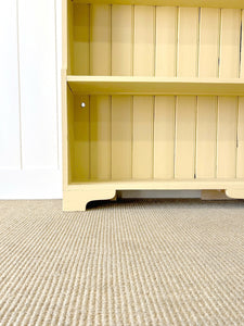 An Antique English Bookcase in Butter Yellow