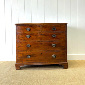 A Large Antique English Bow Front Mahogany Chest of Drawers