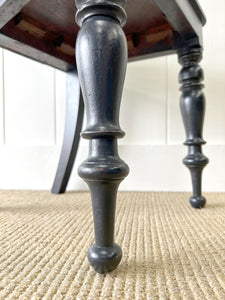 An Antique English Ebonized 19th Century Hall Chair