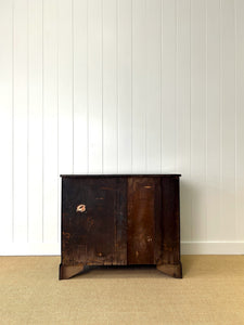 An Ebonized Antique English Chest of Drawers/Dresser