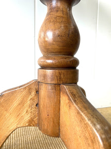 An Antique English Birch Tilt-top Table
