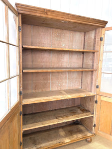 An English 19th Century Pine Bookcase with Glazed Doors
