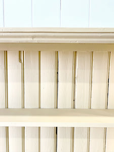 An Antique English Bookcase in Butter Yellow