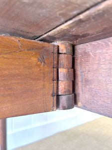 An Antique Mahogany Drop Leaf Dining Table with Pad Feet
