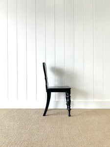 An Antique English Ebonized 19th Century Hall Chair
