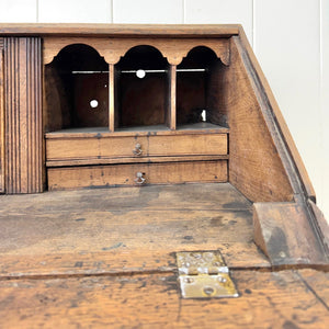 An Antique English Georgian Cumbrian Washed Oak Slant Front Desk