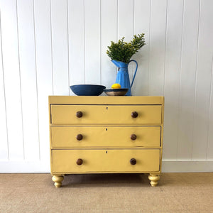 An Antique English Pine Chest of Drawers or Dresser Painted Yellow