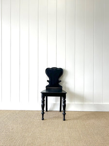 An Antique English Ebonized 19th Century Hall Chair