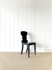An Antique English Ebonized 19th Century Hall Chair