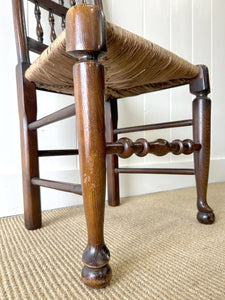 A Vintage Set of 6 English Oak Spindle Back Chairs with Rush Seats