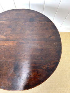 A George III Oak Circular Tilt-Top Tripod Tea Table