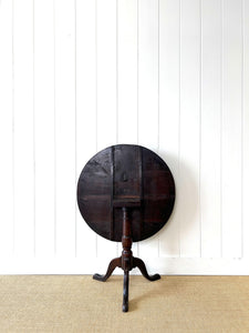 A George III Oak Circular Tilt-Top Tripod Tea Table