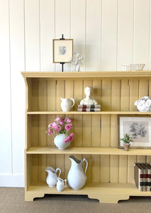 An Antique English Bookcase in Butter Yellow