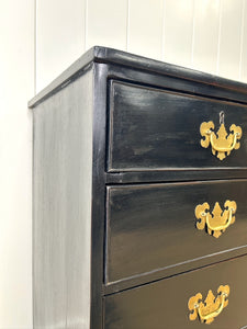 An Ebonized Antique English Chest of Drawers/Dresser