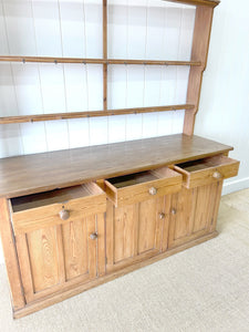 An Early 19th Century Monumental Pine Welsh Dresser or Cupboard