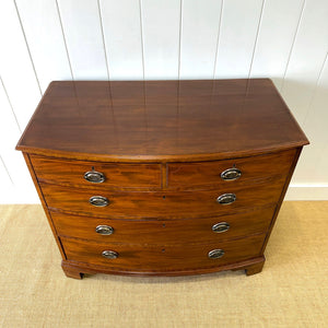 A Large Antique English Bow Front Mahogany Chest of Drawers