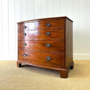 A Large Antique English Bow Front Mahogany Chest of Drawers
