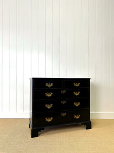 An Ebonized Antique English Chest of Drawers/Dresser