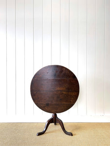 A George III Oak Circular Tilt-Top Tripod Tea Table