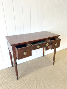 An Antique English Desk or Table with Three Drawers
