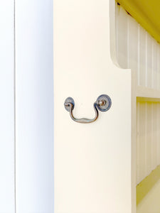 An Antique English Bookcase in Butter Yellow