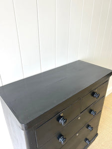 An Ebonized Antique English Chest of Drawers/Dresser