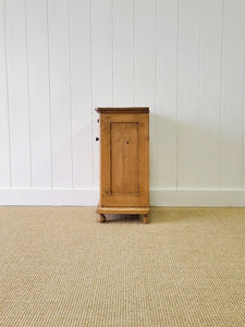 A Vintage Charming Pine Nightstand with Dark Knobs