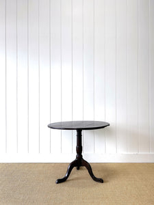 A George III Oak Circular Tilt-Top Tripod Tea Table