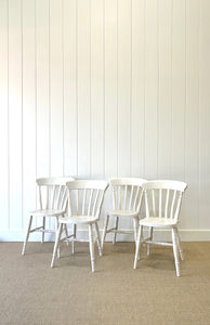 A Vintage Set of 4 White Slat Back Chairs