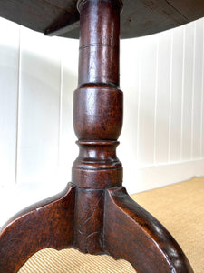 A George III Oak Circular Tilt-Top Tripod Tea Table