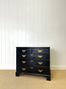 An Ebonized Antique English Chest of Drawers/Dresser