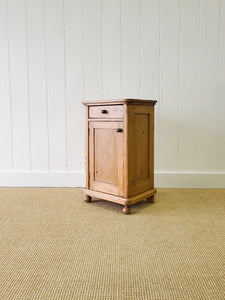 A Vintage Charming Pine Nightstand with Dark Knobs