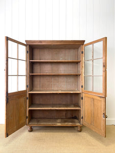 An English 19th Century Pine Bookcase with Glazed Doors