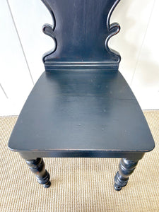 An Antique English Ebonized 19th Century Hall Chair