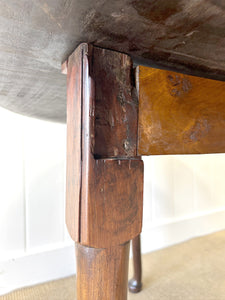 An Antique Mahogany Drop Leaf Dining Table with Pad Feet