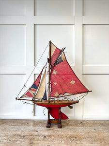 An English Antique Red Pond Yacht with Stand