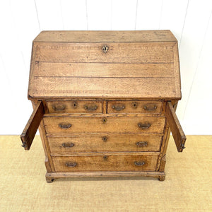 An Antique English Georgian Cumbrian Washed Oak Slant Front Desk