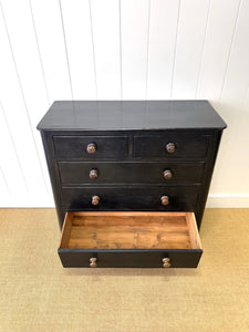 An Ebonized Antique English Chest of Drawers/Dresser